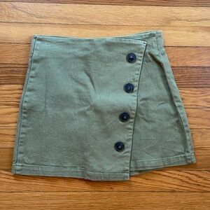 Green button mini skirt
